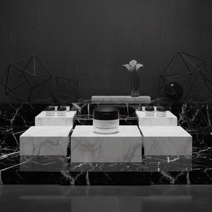 Black and white product display with geometric design and spotlights