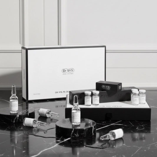 Cosmetic products and packaging on a marble surface with a neutral background
